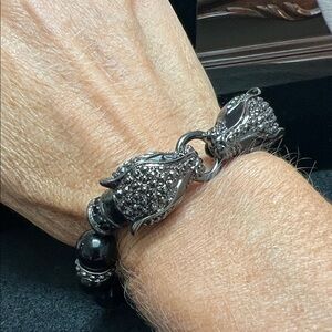 Black Beaded bracelet with Jaguar heads joined by a ring